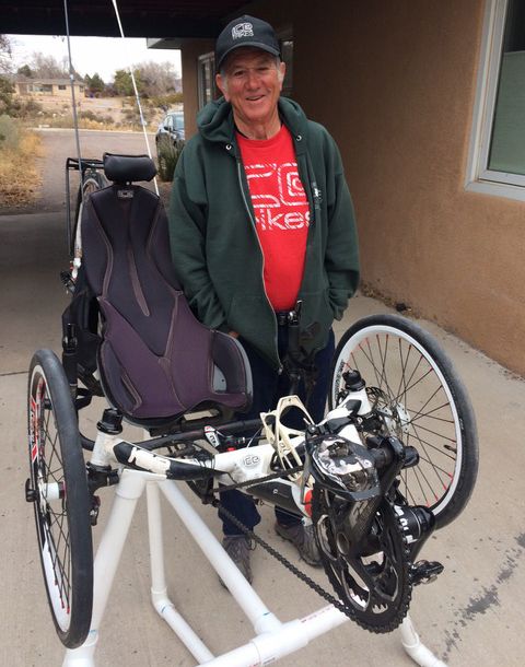 The lucky winner and his steed on a homemade trike stand